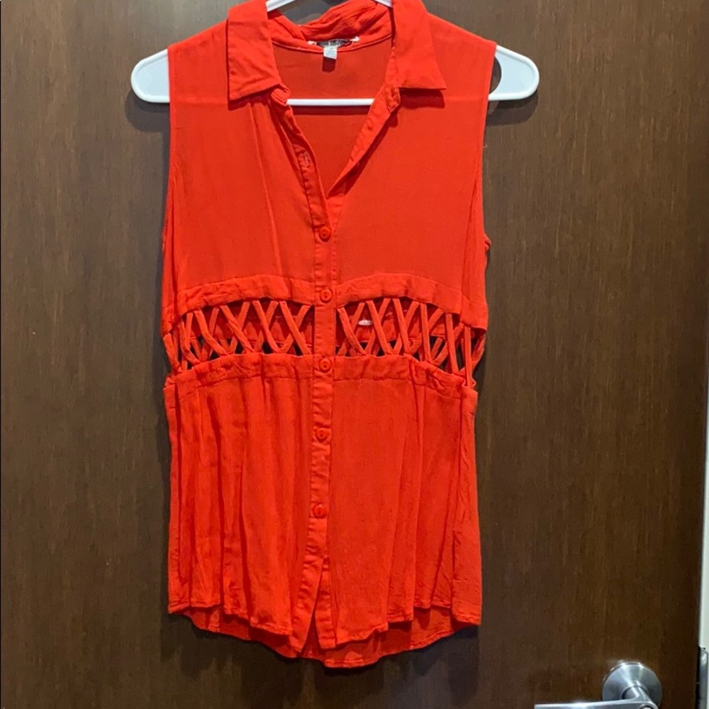 Sleeveless red collared top